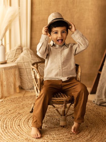 A moment later, a playful personality emerges! This image shows the fun and silly side of childhood, a perfect contrast to the more serious portraits.