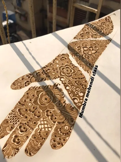 A collection of patch designs on a practice sheet. These are like building blocks for larger mehendi art.