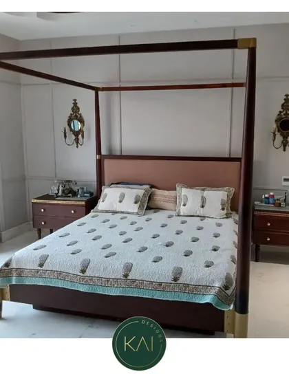 We created this classic four-poster bed to be a timeless centerpiece. The dark wood frame with subtle brass corner details is paired with a soft, upholstered headboard, blending traditional grandeur with modern comfort for a truly regal bedroom.