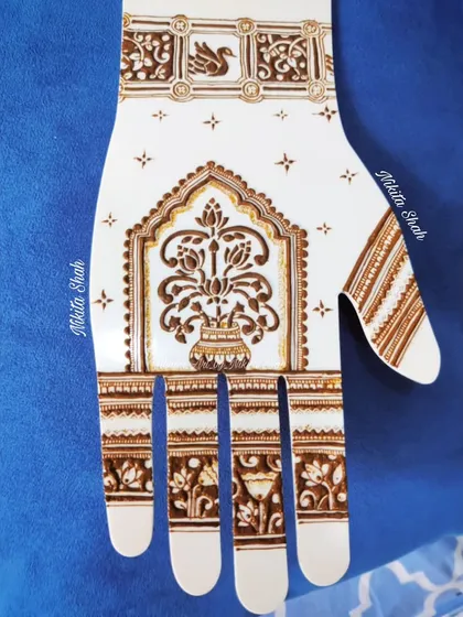 A clear view of the Sanjhi-inspired design with modern cutwork. The central motif is a beautiful vase of lotuses, with a swan detail on the wristband, blending tradition with a clean, modern look.