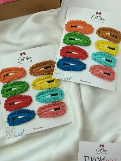 Another look at our full set of eight colorful crochet barrettes, perfect for creating a vibrant and organized clip collection.