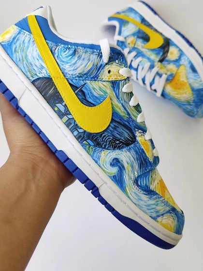 Holding the finished "Starry Night" Dunk. It's amazing to see how a classic piece of art history can be reimagined into modern, wearable art.