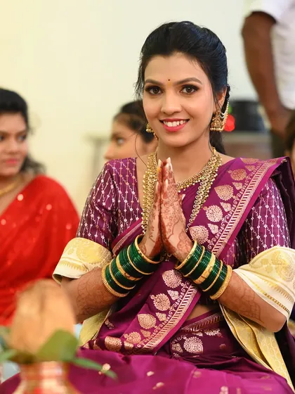 Another angle from the engagement puja, showing the bride's classic look and traditional attire.
