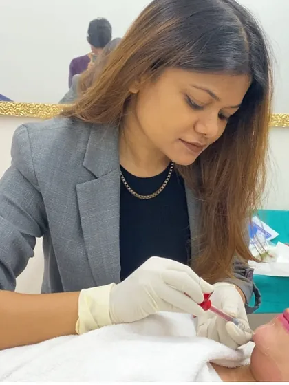 A close-up of me performing a lip filler treatment. I focus on precise injection techniques to sculpt the lips and ensure a smooth, symmetrical outcome.