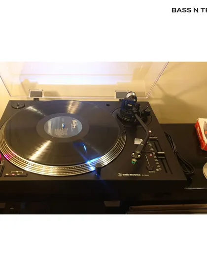 An Audio Technica turntable ready to play. Rediscover your favorite albums on vinyl and experience the tangible connection to music that it offers.