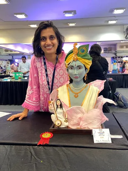 I am so humbled to be standing next to my award-winning sculpted cake. Competing is a wonderful way to push my creative boundaries and connect with other amazing artists in the industry.