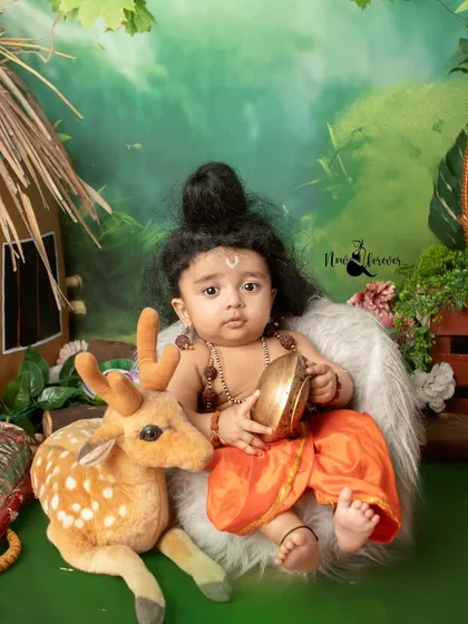 Another adorable portrait from the Ram Navami series, showcasing the intricate details of the costume and the beautiful, lush backdrop.
