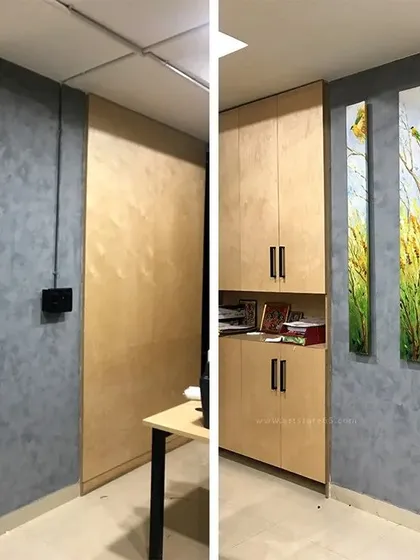 Before and after: We transformed this plain office pillar into a feature wall. The project included applying a modern grey texture finish and installing our custom-painted canvas art, adding a touch of nature to the workspace.