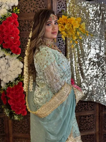 Another angle of the Haldi bride, showcasing the intricate details of her outfit and the way the makeup complements the entire look.