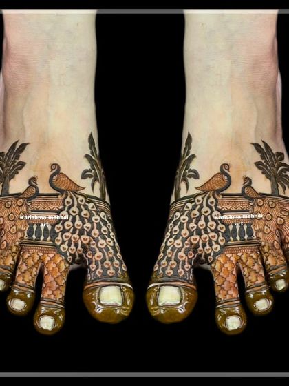 A unique and artistic design for feet featuring peacocks with their feathers spread across the toes. The palm tree motifs add a whimsical touch to this creative piece.