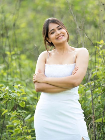 A candid moment of laughter, captured in a beautiful natural setting.