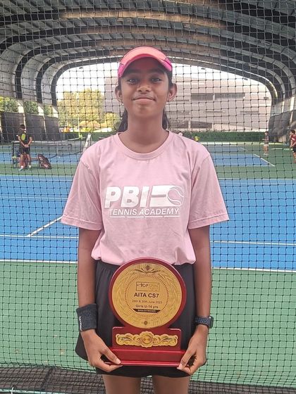 Congratulations to Sanmitha for winning the AITA CS7 girls U-14 singles title. She proudly holds her winner's plaque on our academy court.