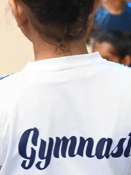 The back of our team shirt says it all. We are proud to be gymnasts.