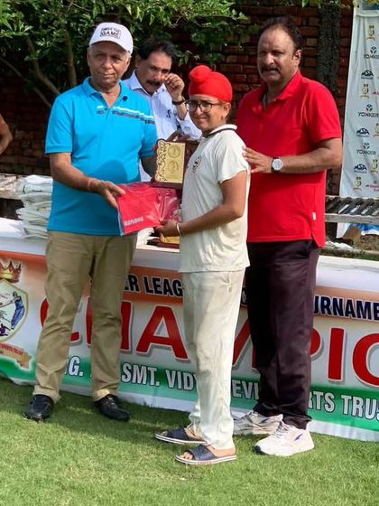 A young Sikh player from my academy proudly accepts his award for a standout performance.