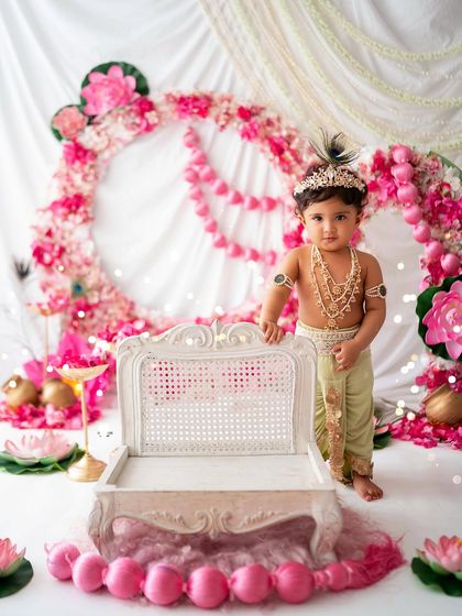 A full-length portrait of this little boy in his Krishna attire, looking straight at the camera.