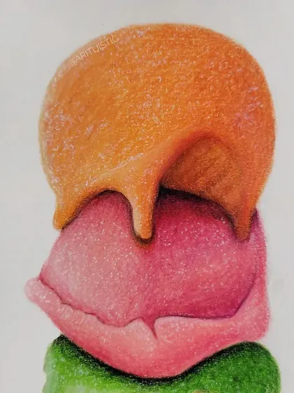 A detail shot of the top two scoops, showing how the orange syrup drips over the pink ice cream.