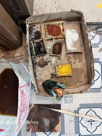 An array of finishes being tested on site. This small box of pigments and polishes is where we experiment with colors and textures, ensuring the final result is exactly as envisioned.