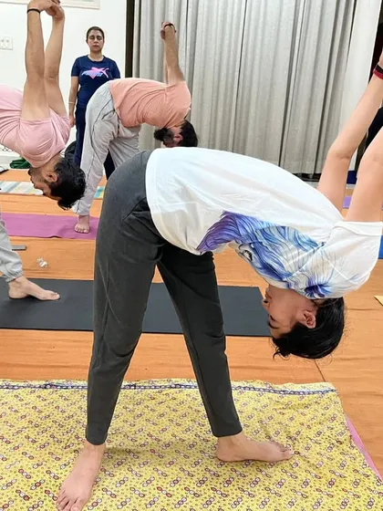 A group of seekers engaged in Yogasanas, aligning their systems with precision and involvement. Each posture is a tool to build awareness and stability from within.