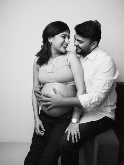 A moment of pure, unscripted laughter. I love capturing the authentic joy between a couple. This black and white shot freezes a happy memory, showing the fun and love that defines their partnership.