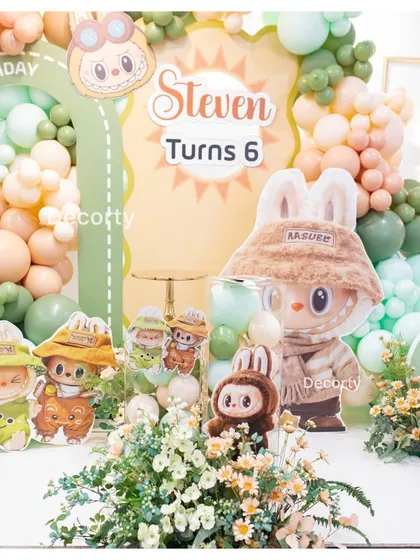 A close-up of the cake table area for the Labubu-themed party, personalized for Steven's 6th birthday.