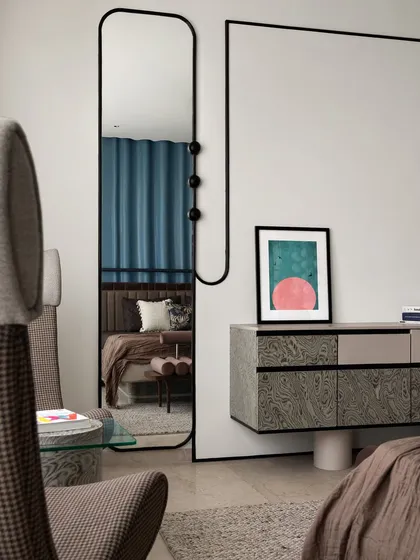 A closer look at the custom console and mirror in the master bedroom. Our philosophy is to see the site as a whole, ensuring every piece, from the large furniture to the smallest artwork, contributes to a cohesive and seamless design narrative.