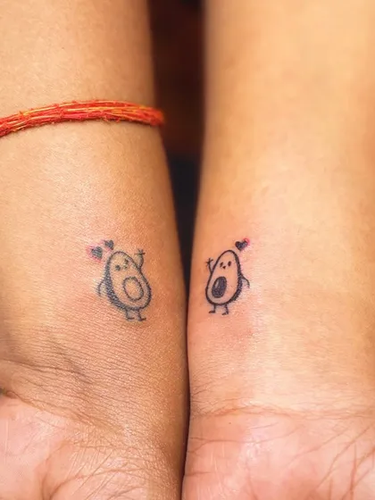 Cute matching avocado tattoos for a couple. A fun and quirky way to show your connection.