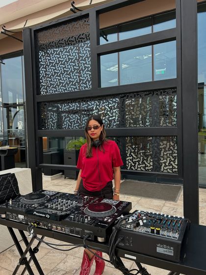 Standing by my decks after a set. The feeling of a successful performance is something I want all my students to experience.