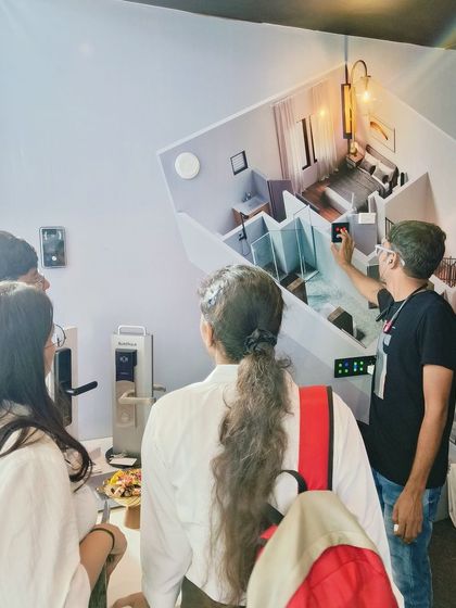 A glimpse from our booth at NEXKNOS 2024 in Udaipur, where visitors are getting a hands-on demo of our smart home technology.