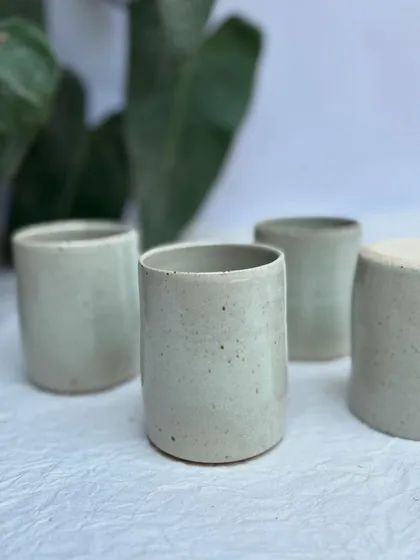 A set of our White Rabbit tumblers. You can see the subtle variations in size and glaze that are the hallmark of handmade pottery.