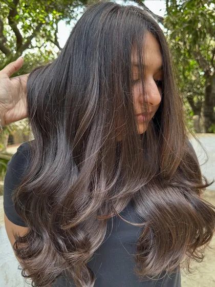 Her first hair color, and we went with a beautiful 'Cocoa Bean' shade. This is a great choice for a first-timer, as it's a subtle, rich brown that enhances natural hair color without being too dramatic.