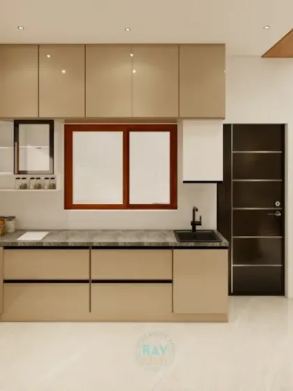 A render of a spacious L-shaped kitchen with a breakfast counter. The design takes advantage of a large window for natural light, creating a bright and pleasant cooking environment.