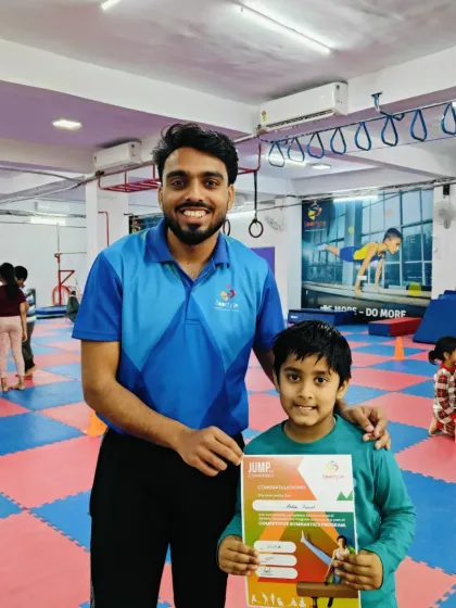 This young boy is excited to show off his "JUMP" program certificate.