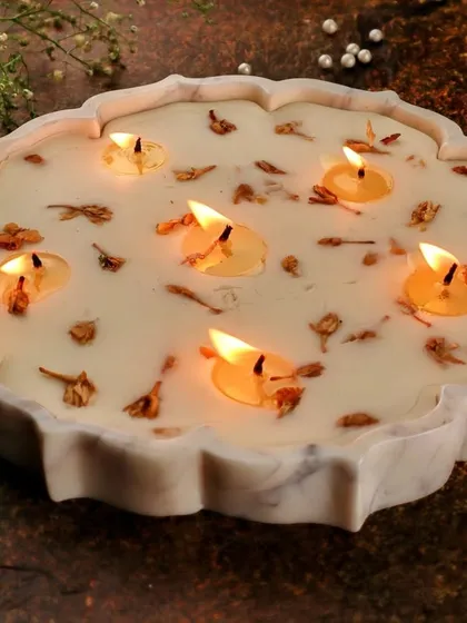 This is my 9-inch Lotus Marble Urli Candle, a true centerpiece designed to transform your space. I hand-pour natural soy wax into a beautifully carved marble urli, creating a piece of decor that feels both luxurious and timeless. It’s perfect for festive occasions or as an elegant statement piece in your living room.