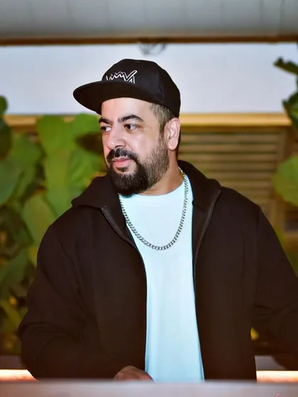 A candid shot of me at the decks, getting ready to drop the next track.