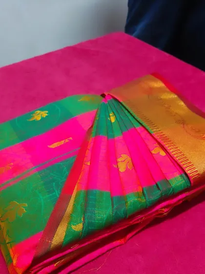The final presentation of a box-folded saree. It's not just about folding, it's about preserving the elegance of the garment.