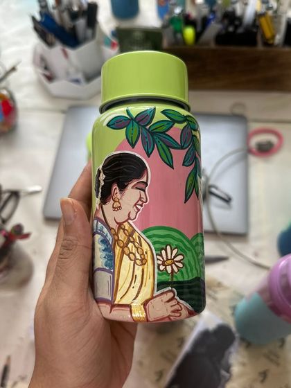 A personalized Milton bottle painted with a beautiful portrait of a mother, a perfect Mother's Day gift.