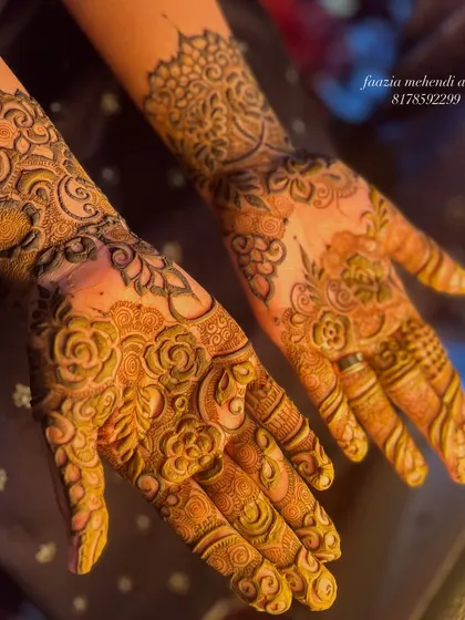 A completed heavy henna design, ready for the bride's big day. The patterns are dense and full of detail.