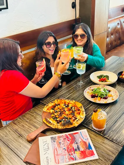 Cocktails, gossip, and pizza. This is my kind of therapy. Grab your friends, order a round of drinks, and let the good times roll. I’ll handle the food.