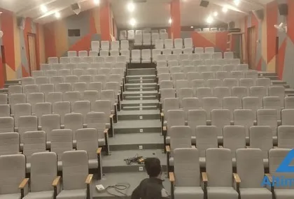 A front-on view of the seating arrangement from the stage during the final cleanup. This shot emphasizes the scale of the venue and the precision required in designing an AV system for such a large space.