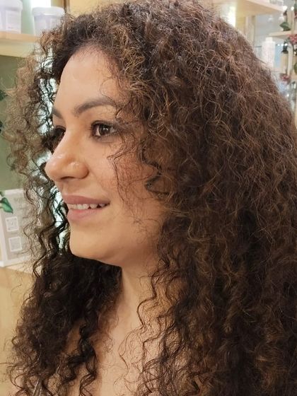 The profile view highlights how the new hair colour complements her features, creating a radiant and confident appearance.