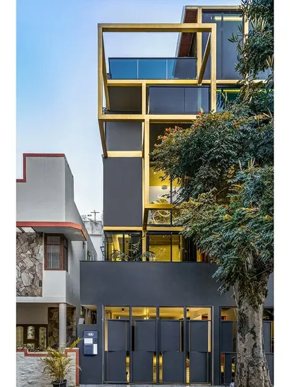 For the SOL House on a compact urban plot in Bangalore, we used a distinctive yellow steel exoskeleton. This structural grid not only defines the building's form but also creates a series of interconnected indoor and outdoor spaces, balconies, and terraces, demonstrating our method of crafting unique architectural identities.