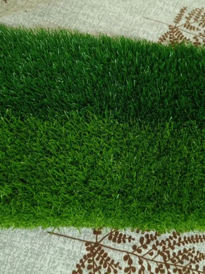 A sample of the 30mm dual-green sports grass. This turf is often used for multi-sport areas or practice grounds, offering good resilience and a professional look.