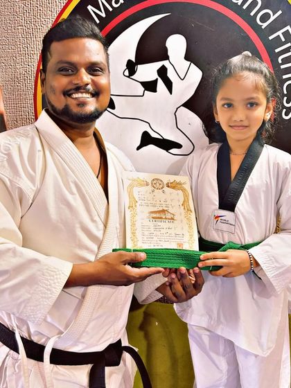 National Martial Arts and Fitness Academy - Kids Martial Arts & Fitness The Journey of Discipline: Belt Graduations photo 7