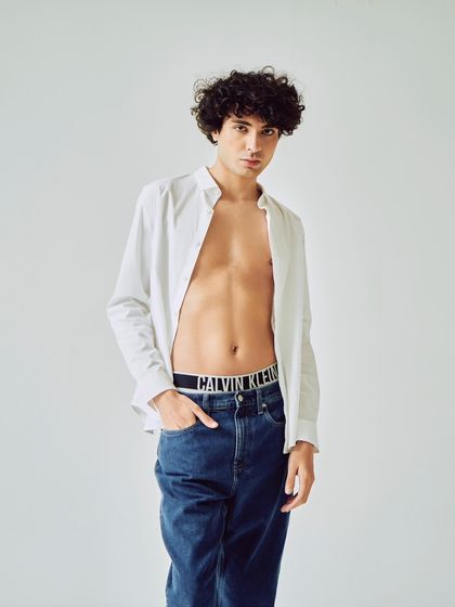 Part of a campaign celebrating diversity, this shot features a simple, classic look. I styled an open white shirt with iconic Calvin Klein jeans and underwear for a timeless and relaxed feel.