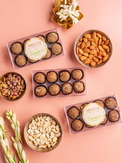 Here is a closer look at my nutritionist-approved laddoos, surrounded by their wholesome ingredients like cashews, almonds, and pistachios. It's a gift of health and love for Raksha Bandhan.