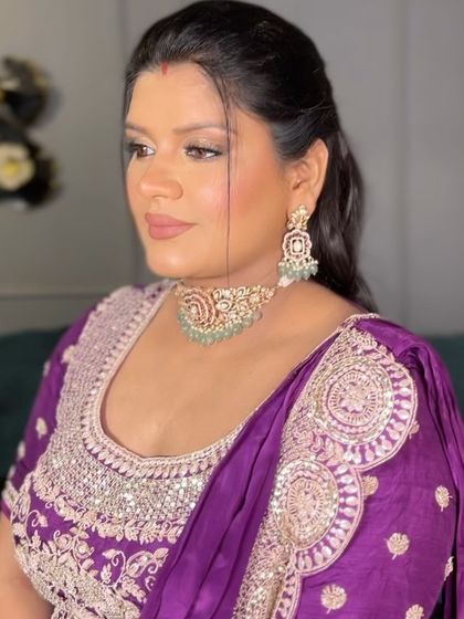 A side profile of the finished look. The makeup enhances her features beautifully, giving her a confident glow.