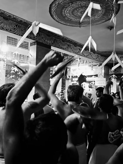 The energy is at its peak as our artists raise their hands in unison during a climactic moment of the Melam at Ulsoor Ayyappan Temple.