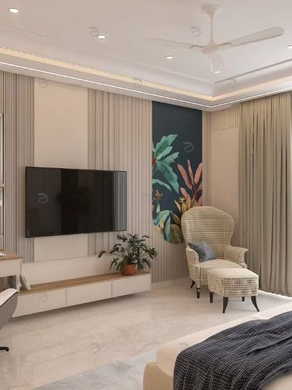 Another view of the master bedroom, highlighting the TV unit and a comfortable armchair with an ottoman, creating a perfect corner for reading or relaxing.