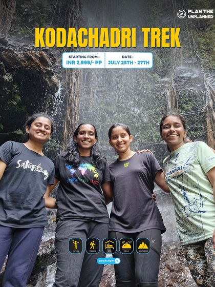 Four friends enjoying a moment by a waterfall on the Kodachadri trek.
