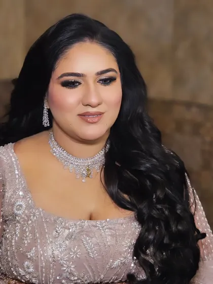 The soft waves in her hair and the glowing skin make this a perfect look for an evening engagement party.